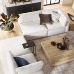 A wooden rustic coffee table complementing the modern living room decor