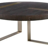 Round white oak coffee table complemented with metal accents.