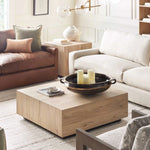 Luxury home featuring a prominent wooden rustic coffee table.