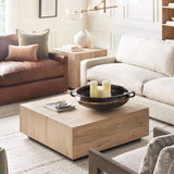 Luxury home featuring a prominent wooden rustic coffee table.