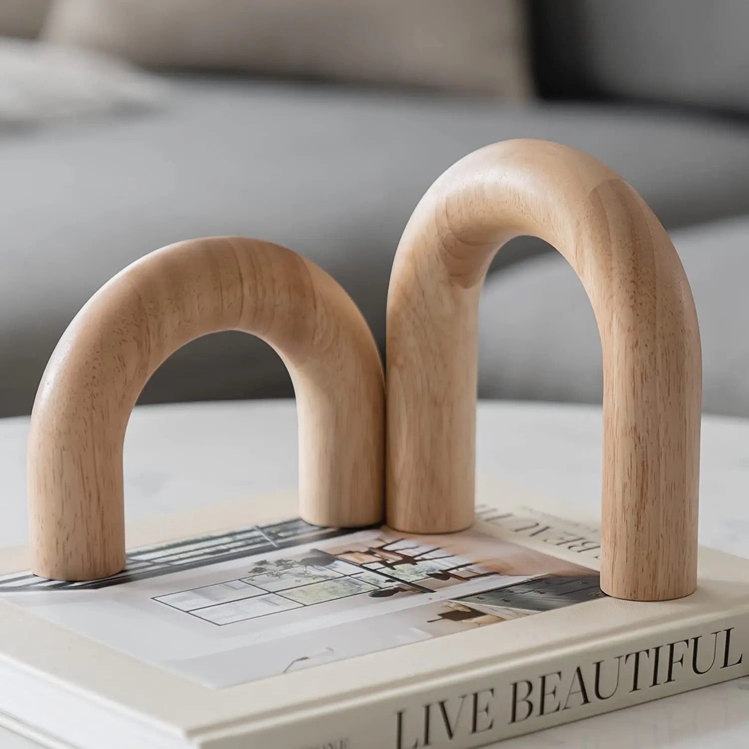 Decorative wooden arches on a graphic design book, blending art and decor.